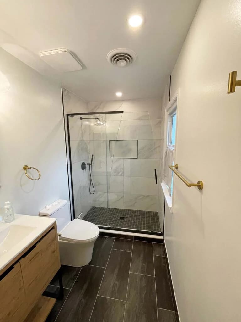 Bathroom with a tub converted to a custom shower by Excell Homes in Rockville, Maryland